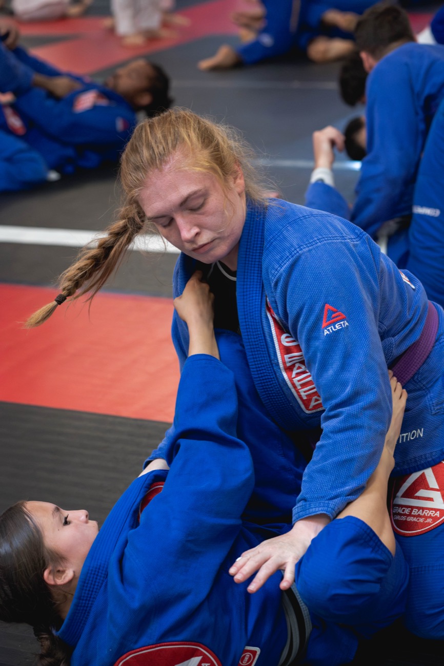 Adults rolling in a Brazilian Jiu-Jitsu class